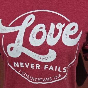 Love Never Fails T Shirt